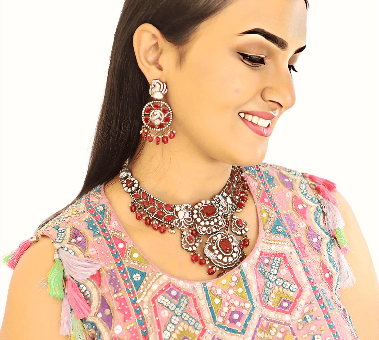 a woman in a pink dress and necklaces