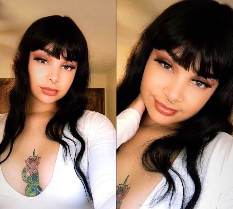 a woman with tattoos on her chest 