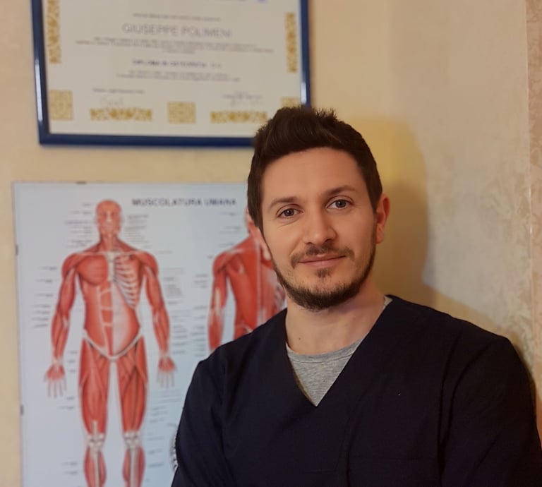 a man in scrubs standing in front of a poster board