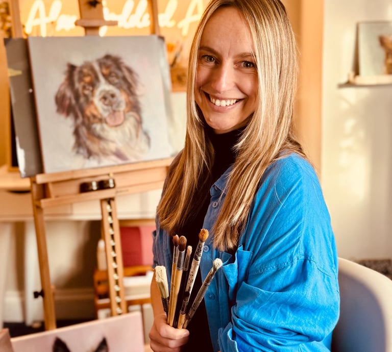 Alex painting in her home studio in West Su