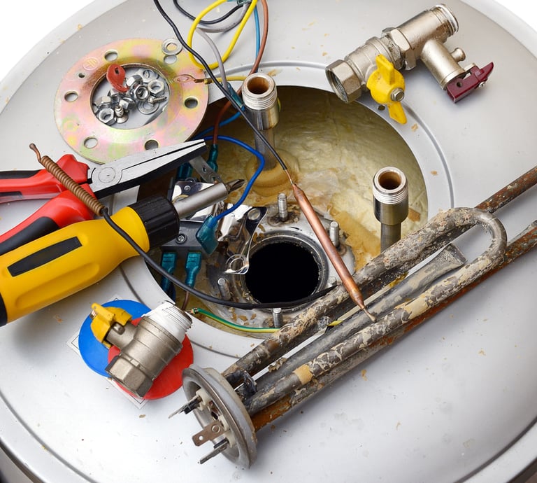 Professional tools and corroded heating element for electric water heater repair service.