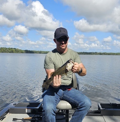 Matt holding a Large Mouth Bass