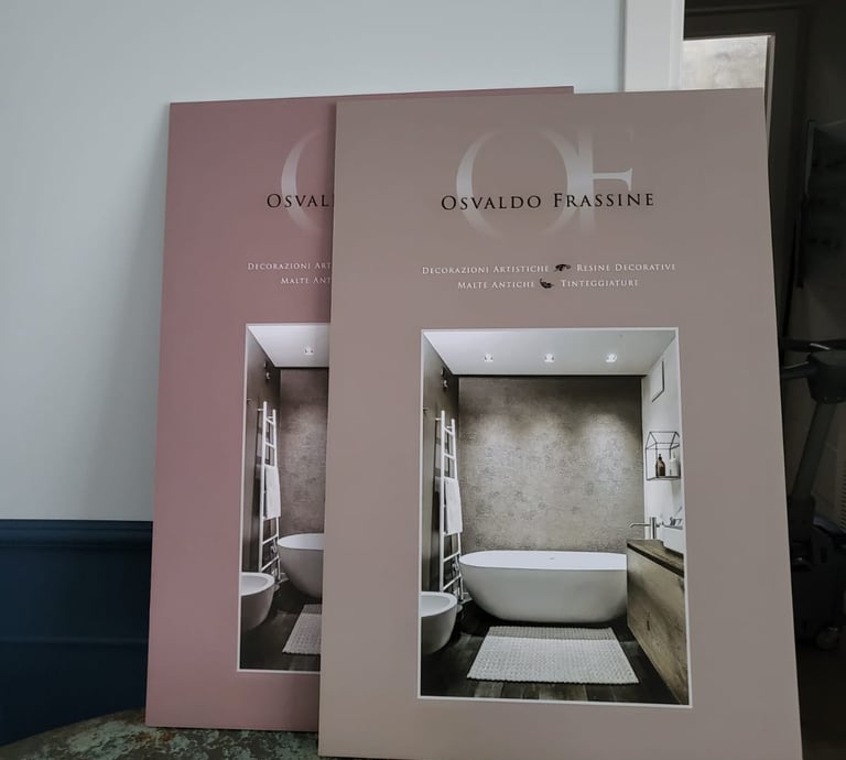 Osvaldo Frassine decorative resin catalogs showcasing modern bathroom interior design and wall finishes.