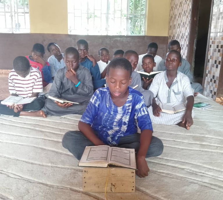 Candid shot of Maakitheena youth focused on their religious studies.