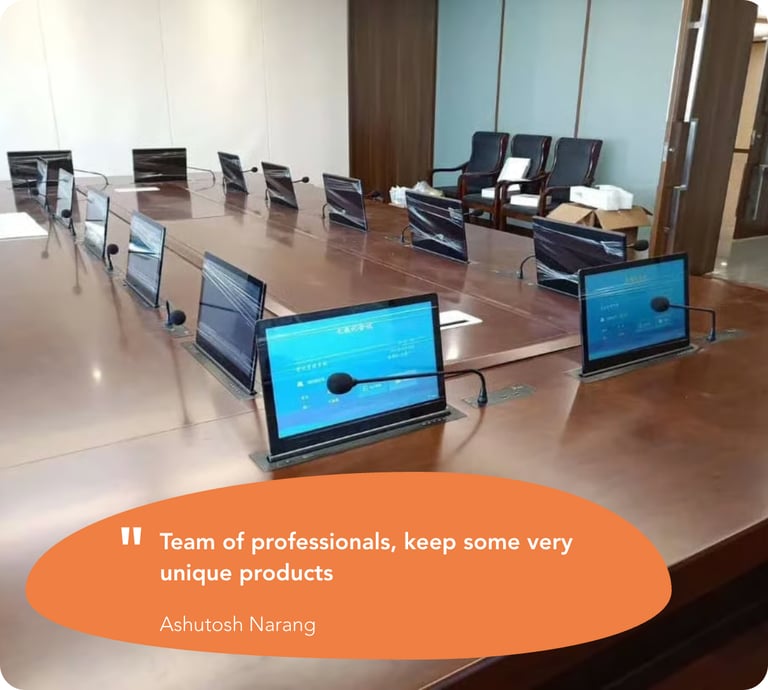 Multiple monitor lifts installed at a customer location in a corporate setting.