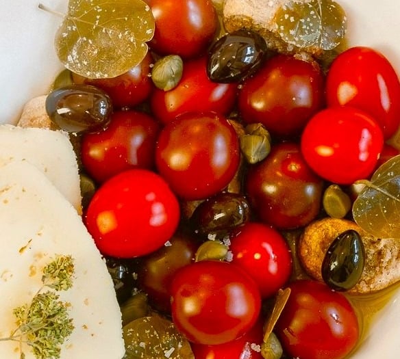 Cherry tomato salad with olives & Naxian cheese prepared by villa eats private chefs Naxos