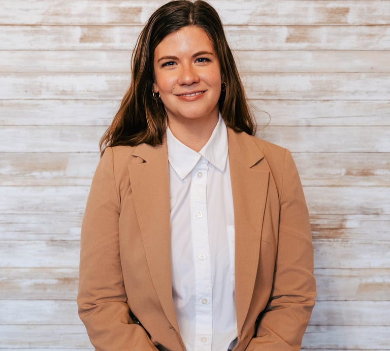 Ariel Weber a social worker and psychotherapist who performs CBT, DBT and ACT smiling 