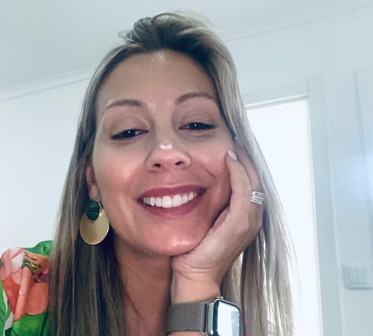 a smiling woman with a watch on her wrist