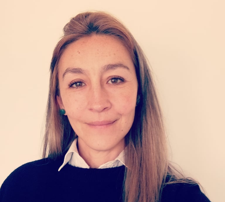 Professional psychologist smiling for a photo in formal wear