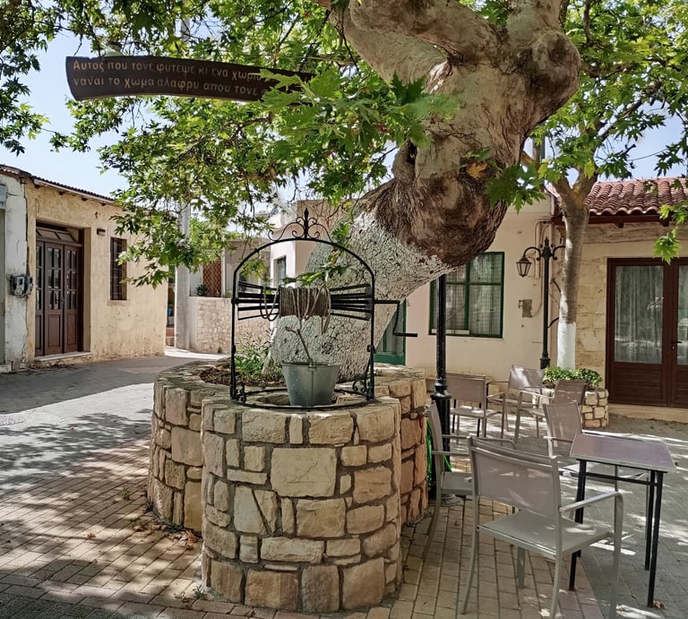 Alagni Village square with a Platanus tree, an old well, and a drinking water spring