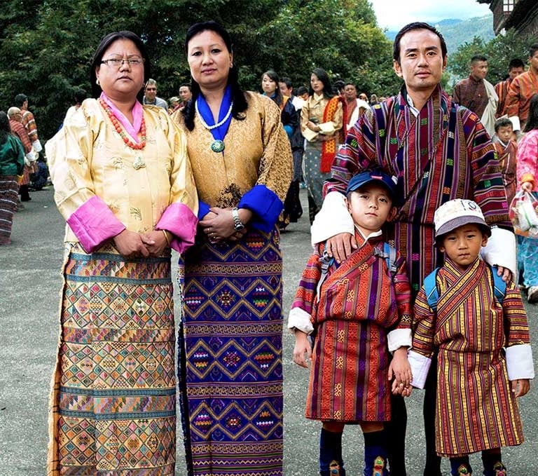 Bhutanese-Family-Draped-In-Their-National-Costumes-During-Masked-Dance-Festival