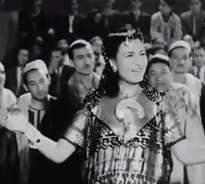 1949 Movie photo of Bellydancer & singer Naima Akif in Lahalibo wearing Assuit dress playing zills