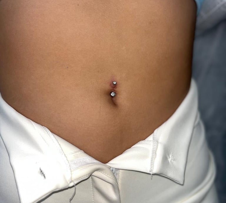 a woman with a piercing on her stomach