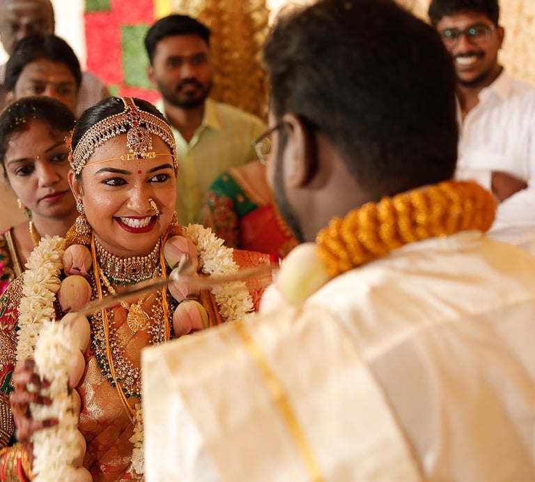 Bride smiling while looking in to grooms face on destination wedding