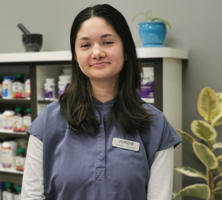 picture of woman with dark hair wearing blue scrubs