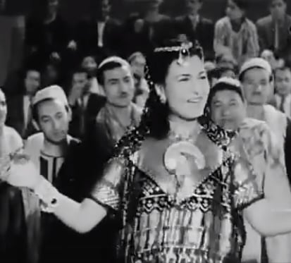 1949 Movie photo of Bellydancer & singer Naima Akif in Lahalibo wearing Assuit dress playing zills