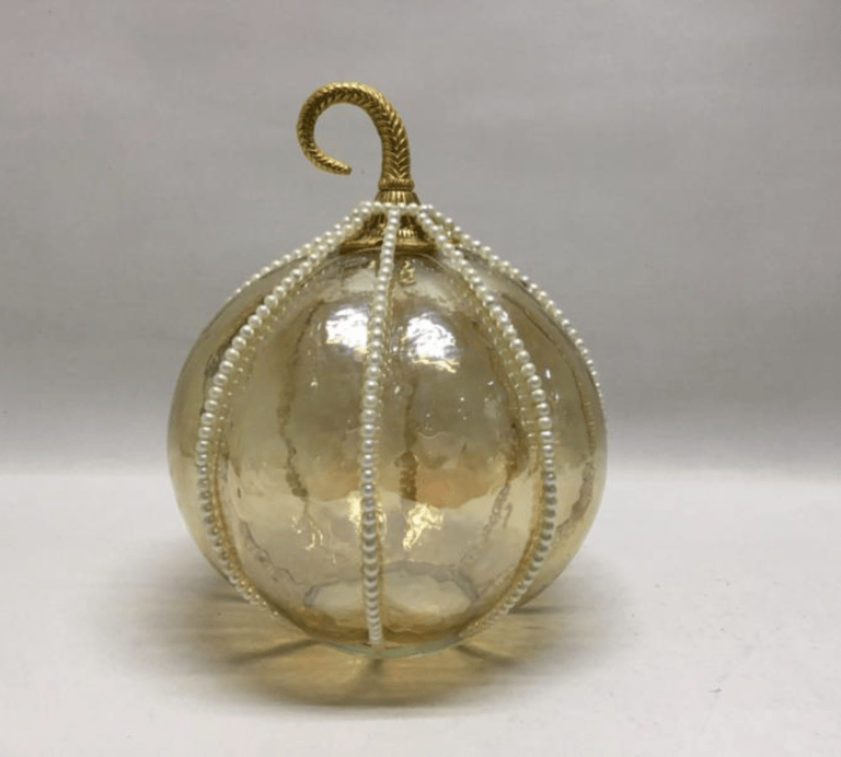 a glass Pumpkin ornament with pearls for Halloween festival 