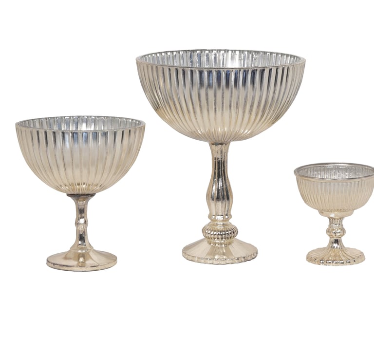 a silver plated glass bowl with a silverware and a silverware pedestal