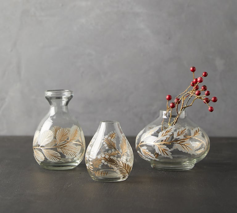 three vases with pine cones etching and gold hand paintedand berries in them