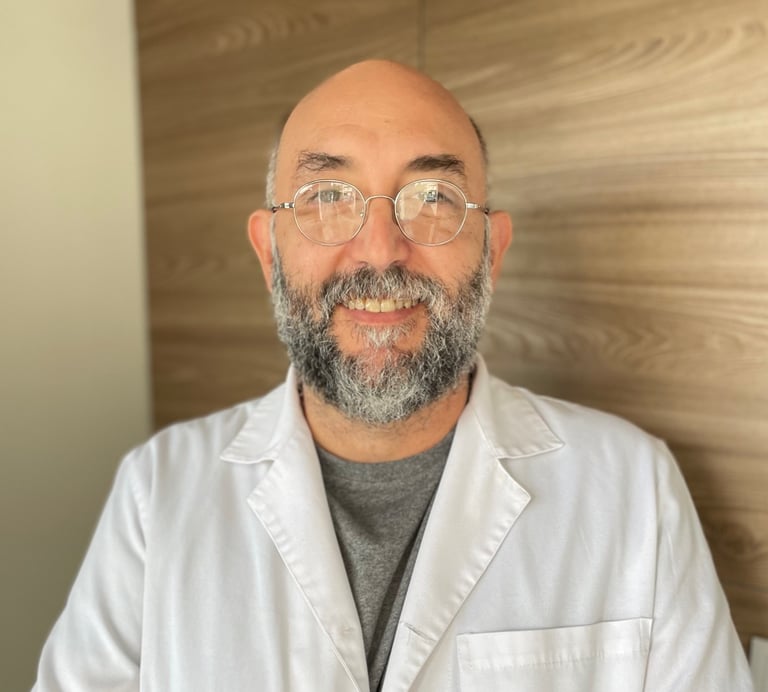 a man in a lab coat and glasses