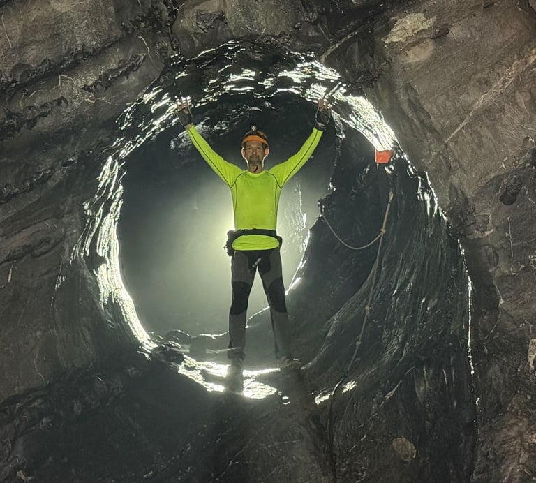 Nick Billington climbing through the James Bond hole in Hang Son Doong Cave to get to doline 1