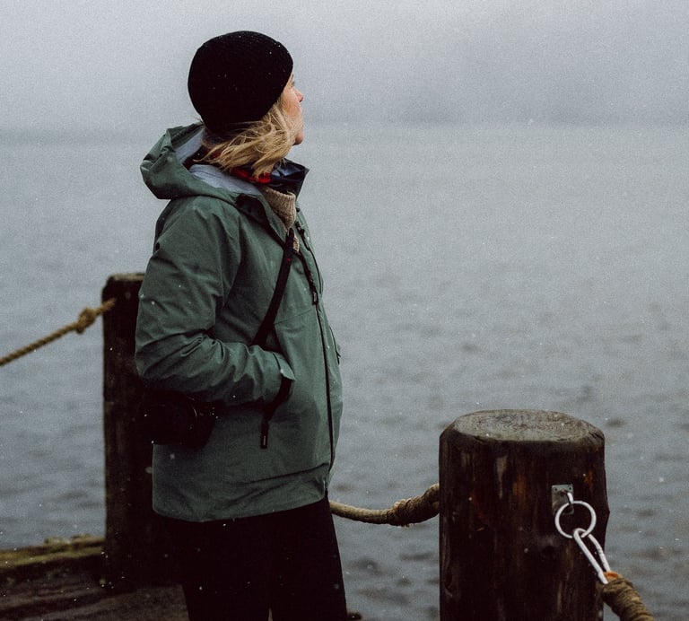 photo of a women wearing a finistere coat in scotland