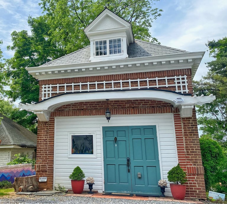2123 rivermont carriage house with green door and white awning