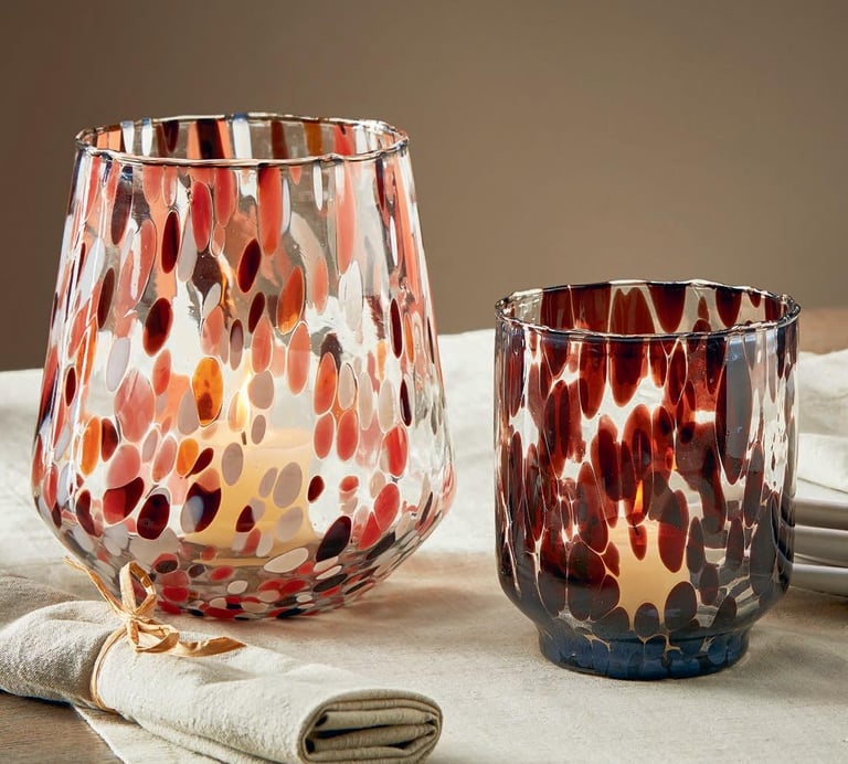 a candle holder in confetti glass
