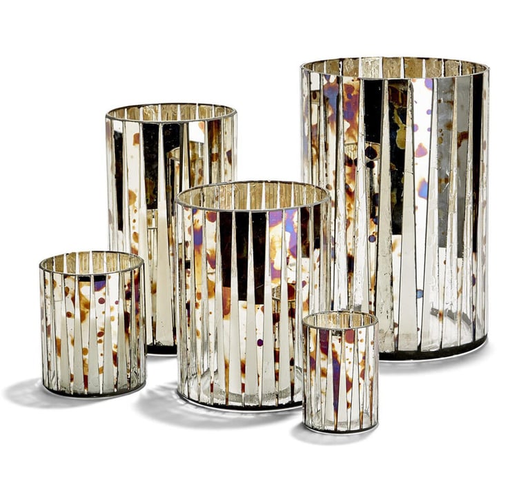 a group of glass vases with a silver mosaic stained glass vase candle holder