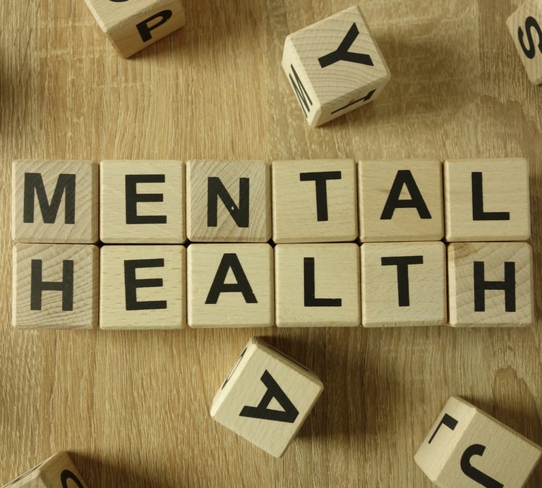 a wooden block with the words mental health written on it