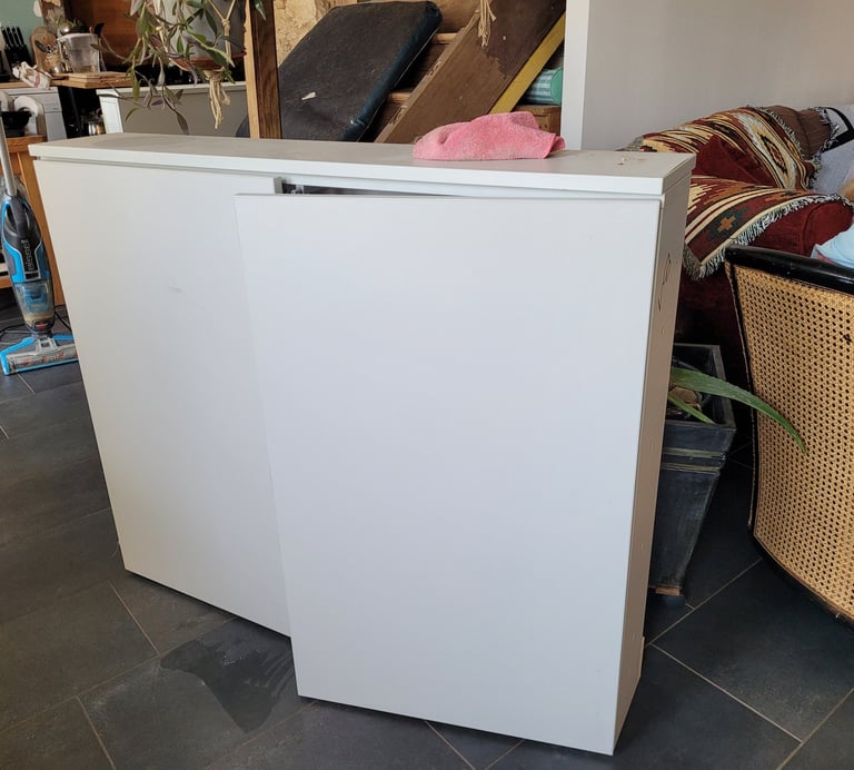 a refrigerator freezer with a refrigerator and a couch