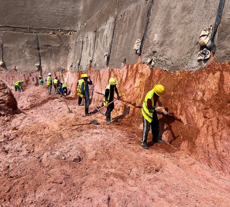 Hillside with soil nailing and geogrid reinforcement for slope stabilization.