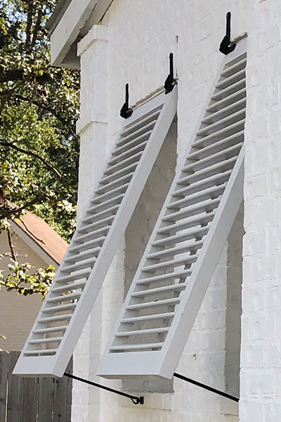 exterior bahama shutters showing a faux tilt rod design