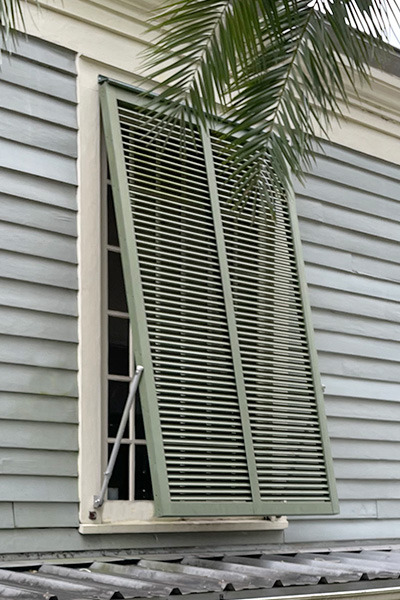 green bahama shutter on a house in new orleans