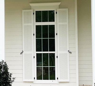 Three framed exterior shutter to complement the window