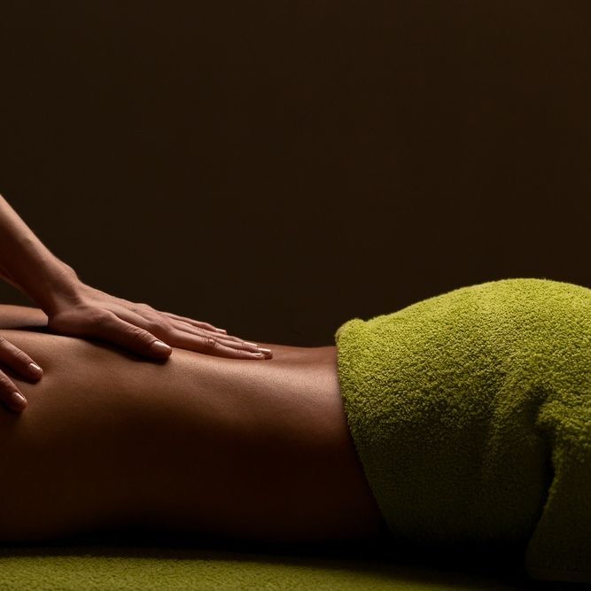a woman getting a massage at a spa