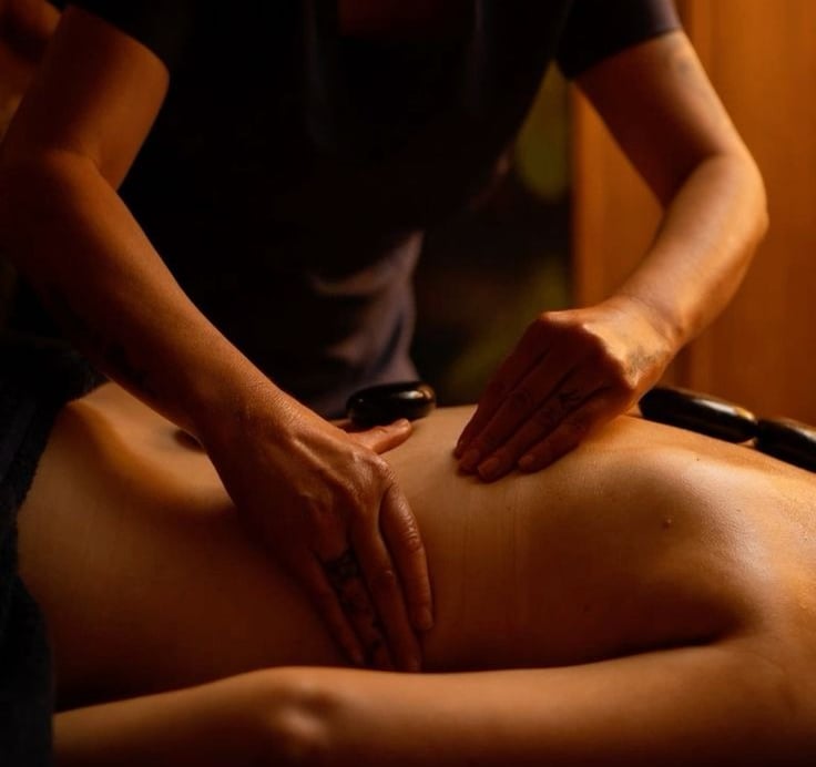a woman getting a massage at a spa