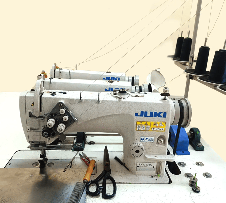 Tanori Hair triple-headed wefting machine used for strong and durable hair weft construction.