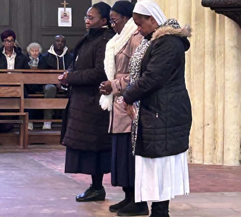 Three Catholic nuns standing in prayer inside a church during a religious service.