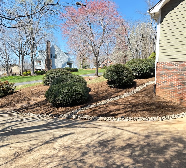 Fresh hardwood mulch installation in Catawba County NC around front foundation beds