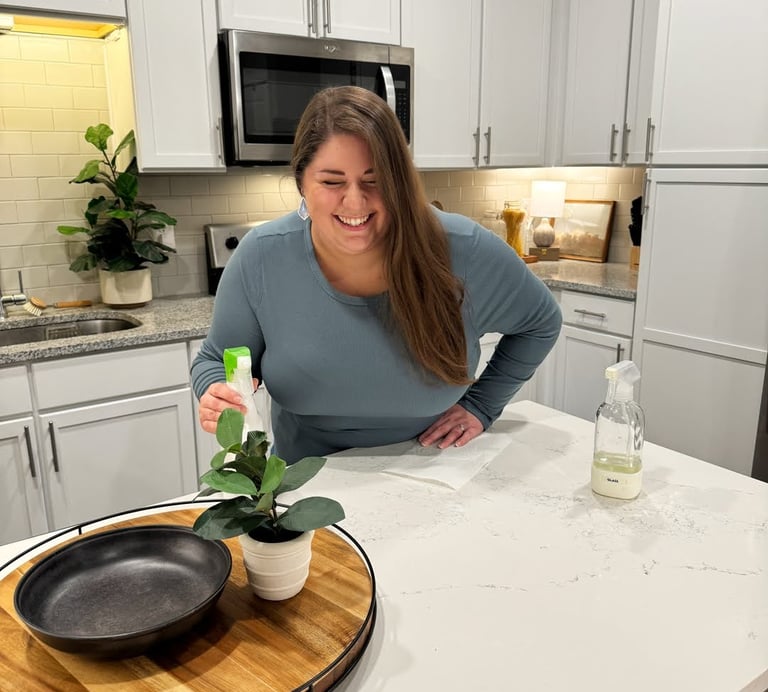 a woman standing in front of a potted plant