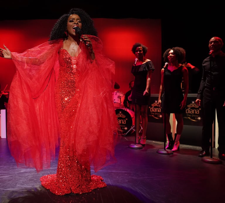 a woman in a red dress and an entire band with backup singers in the background