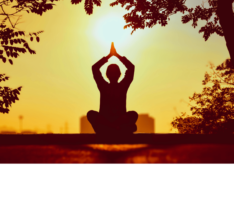 woman seated in lotus position in flow with hands aloft in reverence