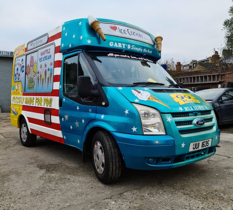 a blue ice cream truck with designs