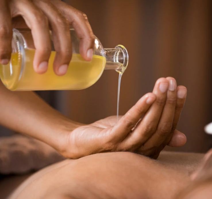 Aromatherapy massage with essential oils for stress relief in Seminyak