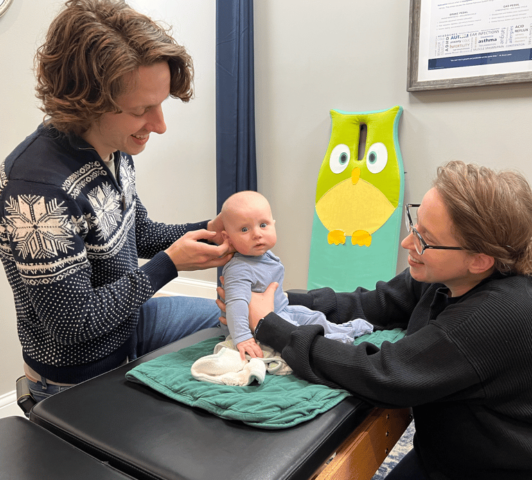 Franklin TN chiropractor explaining how chiropractic can help with colic and constipation