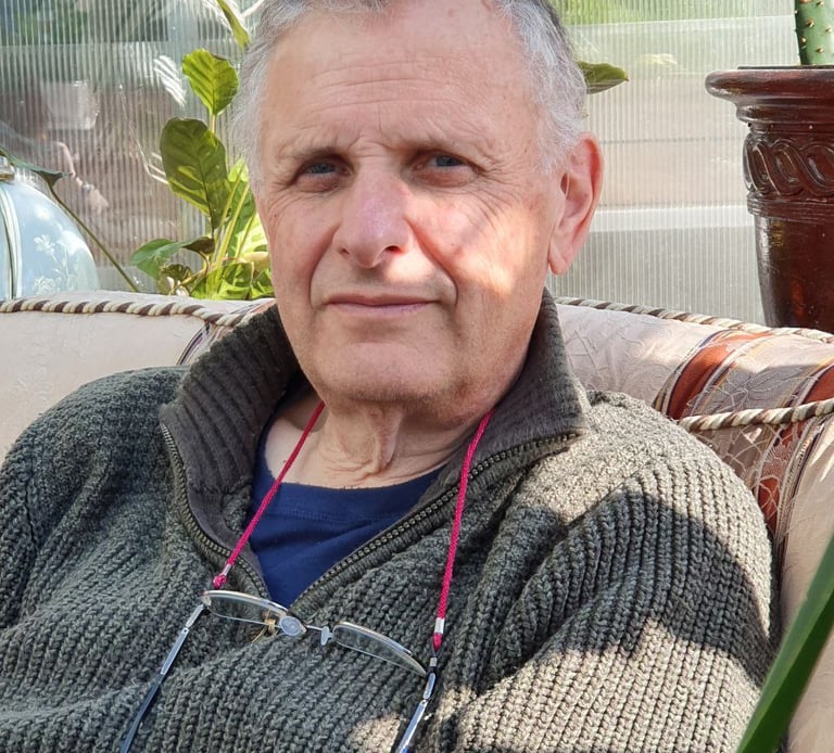 William at home at ease in chair.