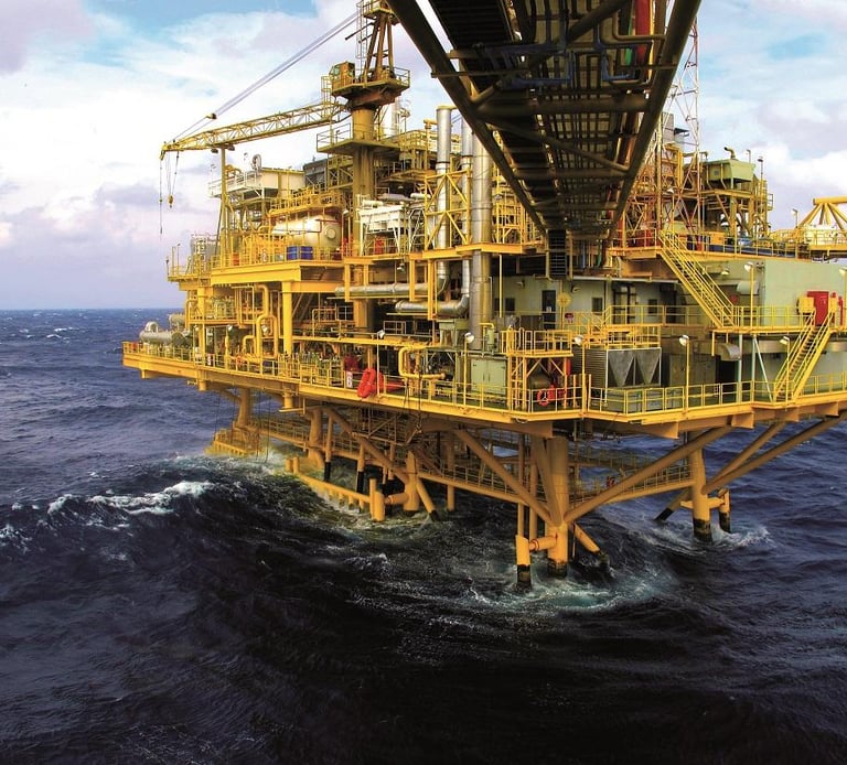 Offshore oil and gas drilling platform structure standing in deep ocean waters.