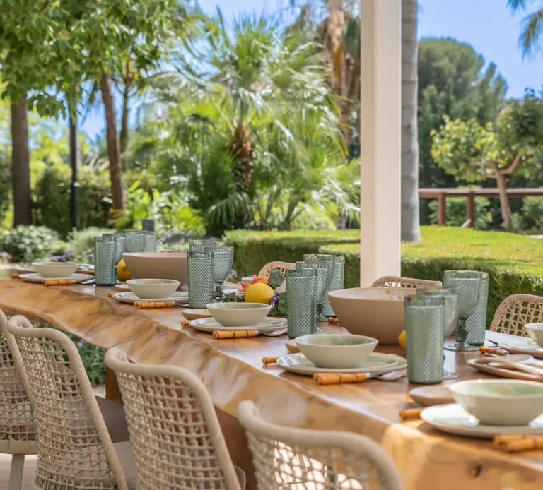 Al fresco dining terrace with wicker chairs at Villa Serenity