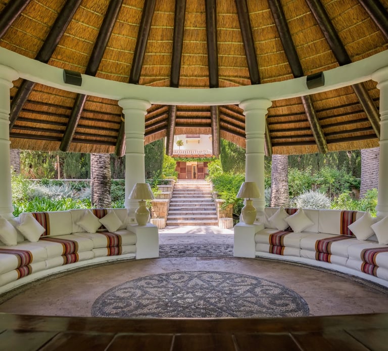 Thatched garden pavilion lounge in Marbella estate